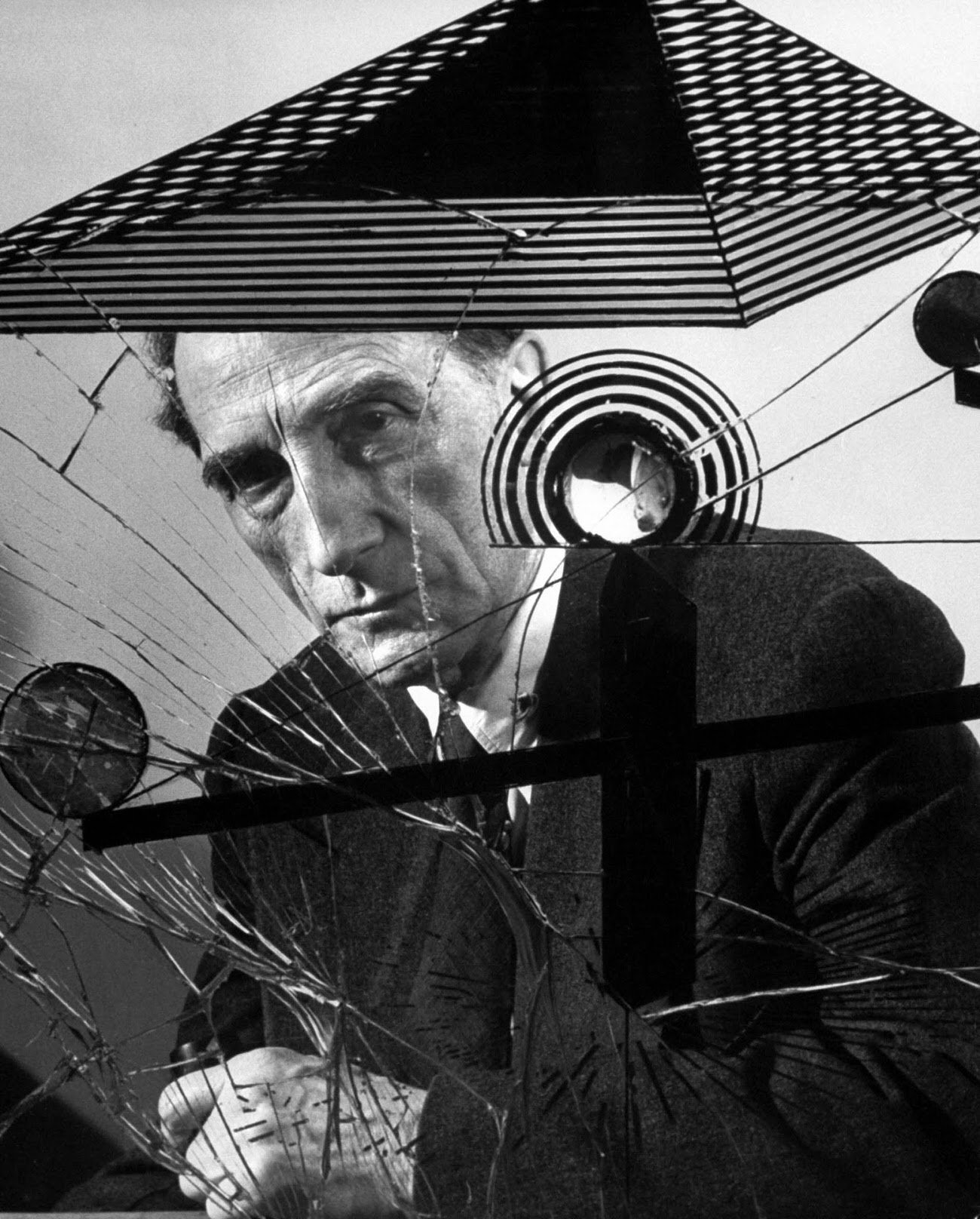 #29 Marcel Duchamp with Dada artwork, 1953.