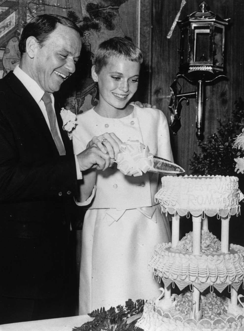 #17 Frank Sinatra & Mia Farrow cutting the cake, Las Vegas, 1966.