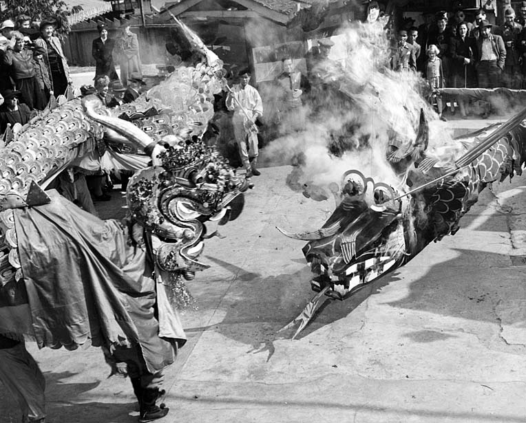 #7 The black and golden dragons fight during New Year’s celebrations in Los Angeles’ Chinatown, 1942.