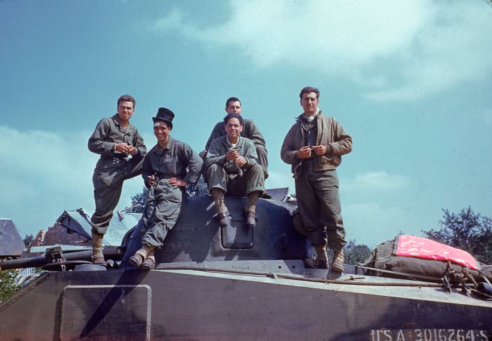 #9 An American tank crew takes a breather on the way through the town of Avranches, Normandy, summer 1944