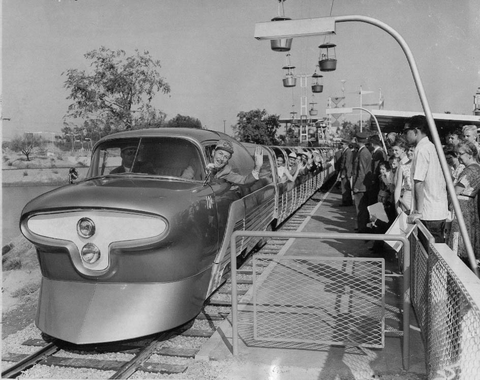#7 Walt Disney at the controls of the Viewliner, a train that ran between Fantasyland and Tomorrowland, 1957