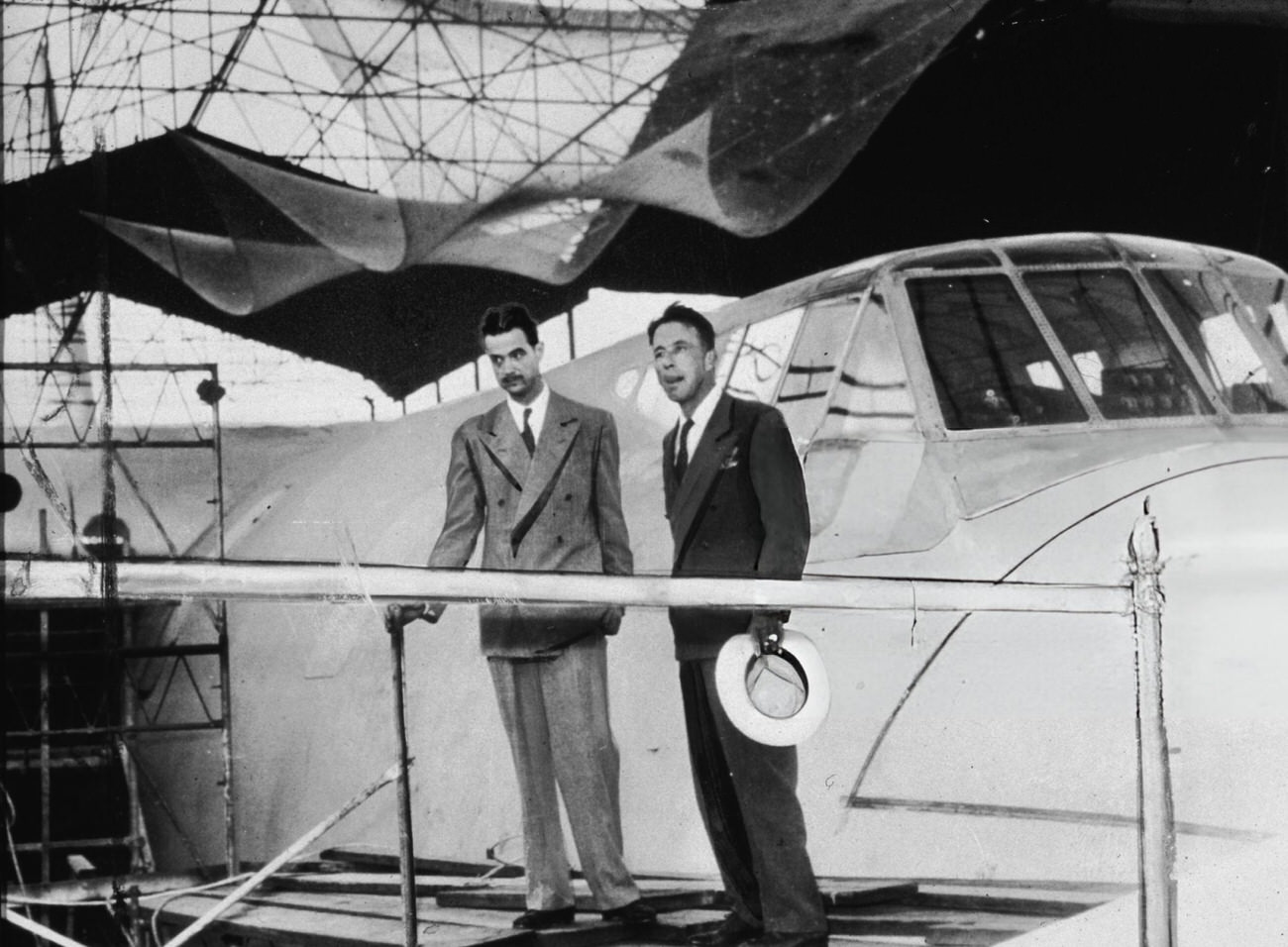 Howard Hughes and an unidentified man near the Spruce Goose’s cockpit, 1947.