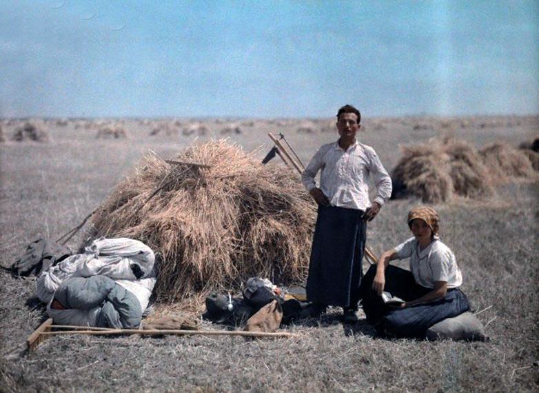 #13 A peasant couple works during harvest in Hungary, January 1930.