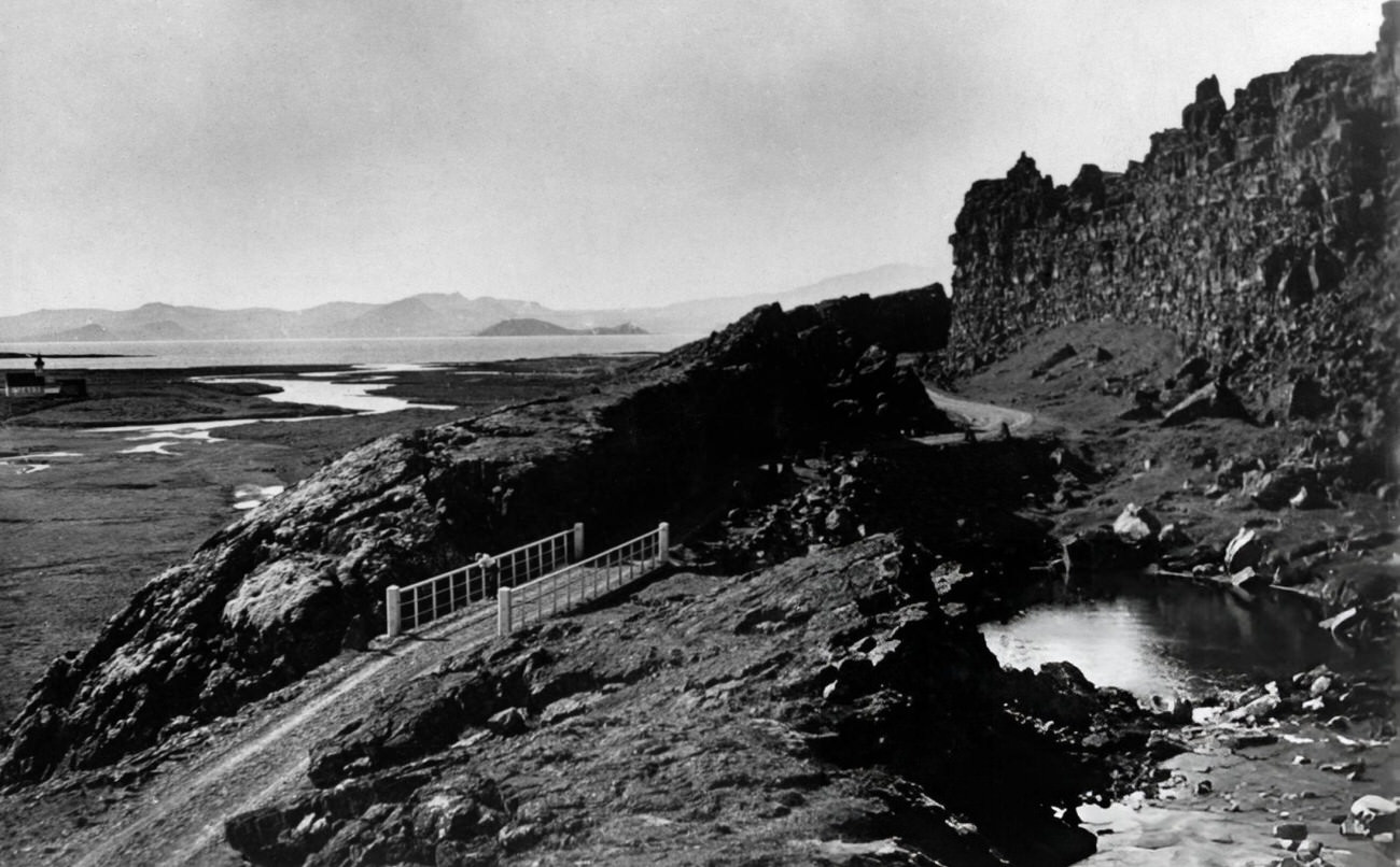 #25 Landscape photograph with bridge and craggy rocks at Thingvellir, Iceland, 1930s.