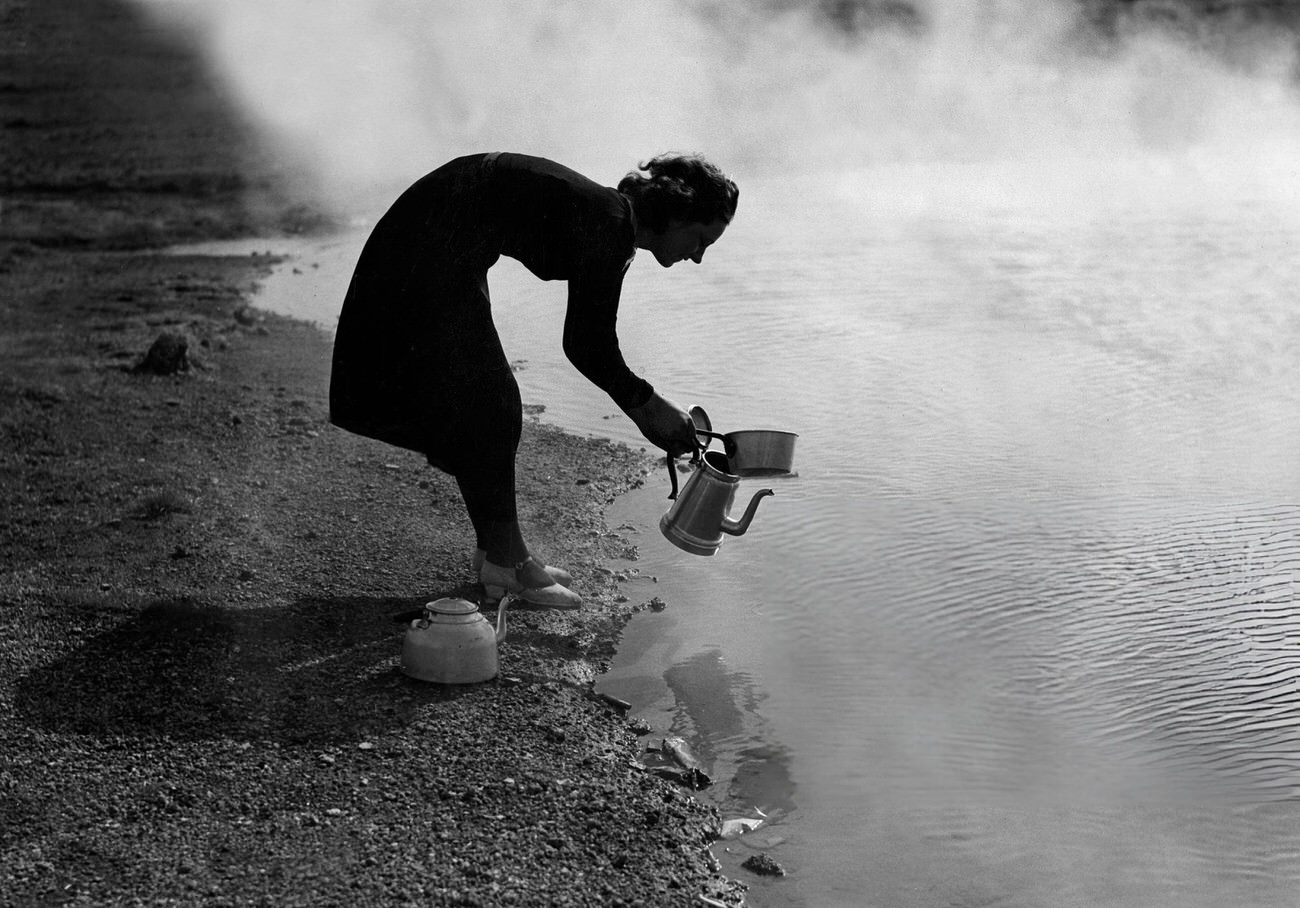 #10 A woman getting hot water near a geyser in Iceland, 1935.
