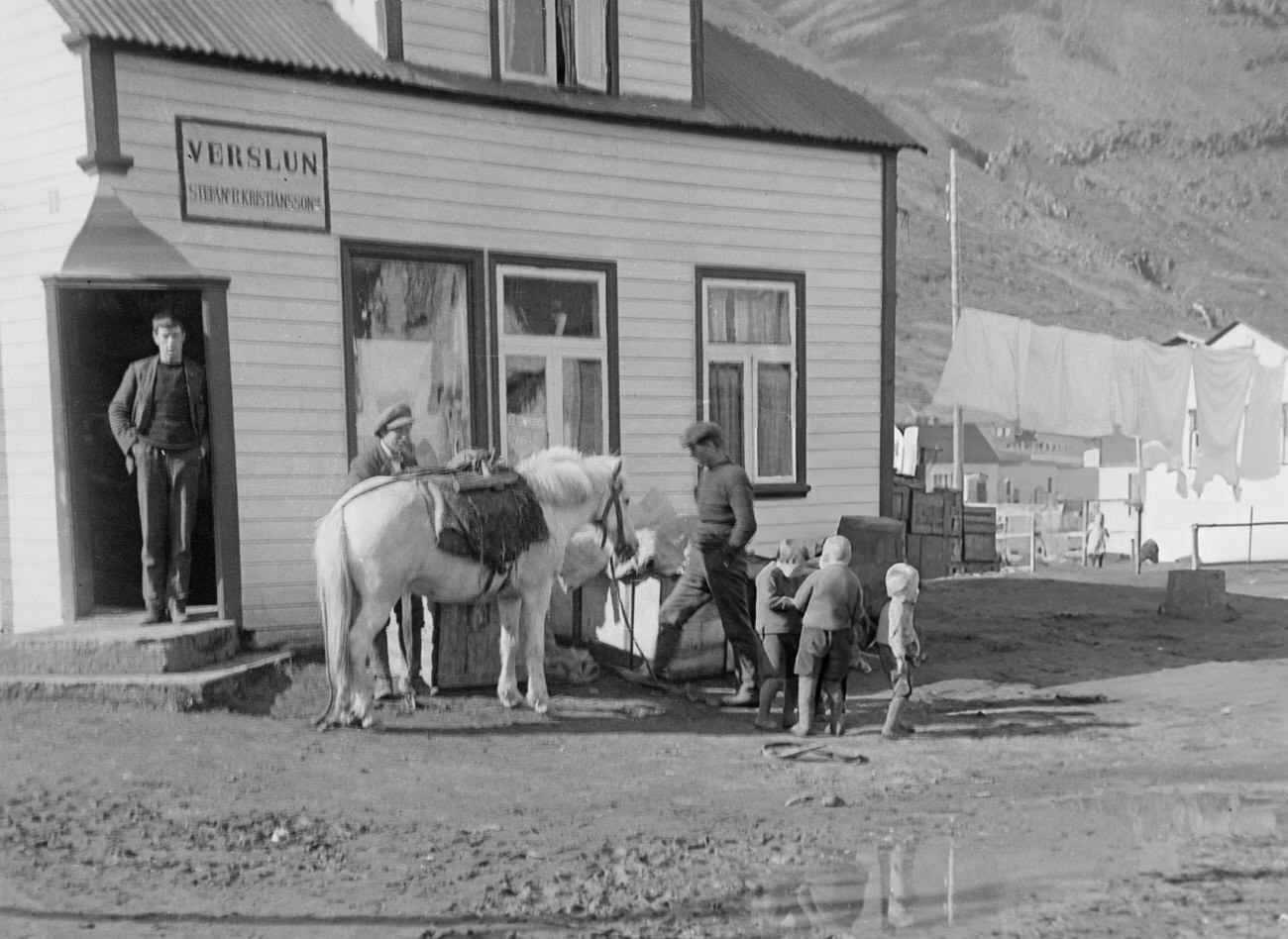 #42 People with a horse outside an inn in Siglufjordur, Iceland, 1935.