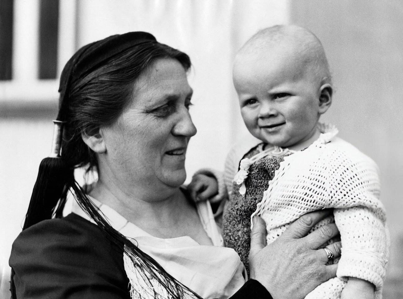 #50 Gudrun Larnsdottir (member of parliament) with grandchild, Iceland, 1934.