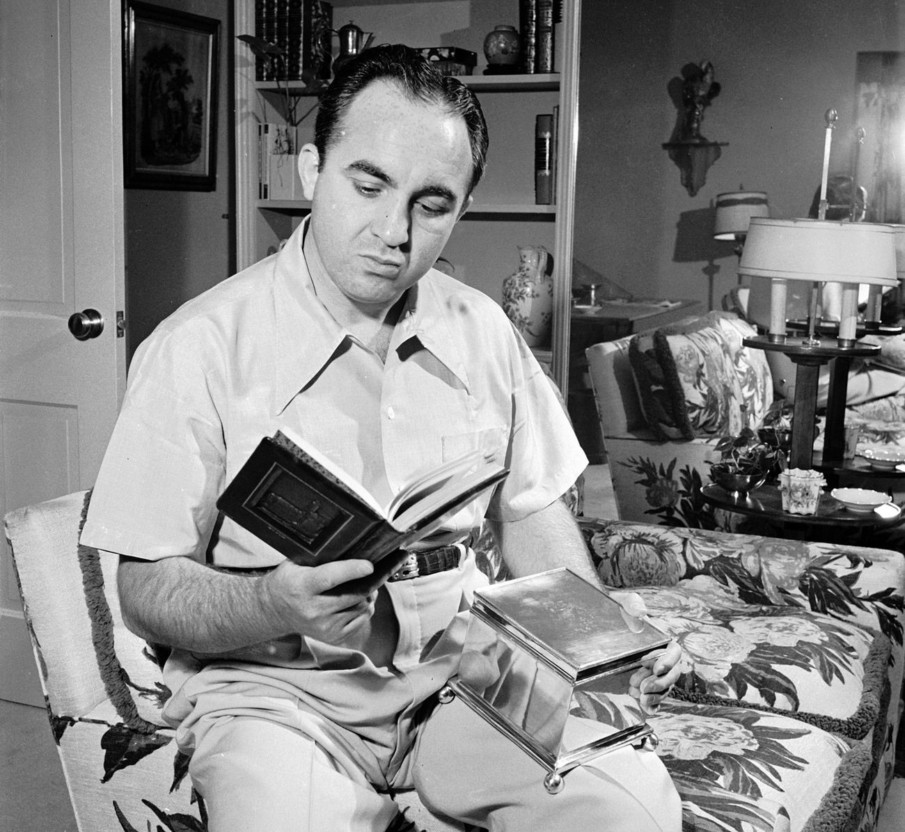 #16 Mickey Cohen at home with a book given to him by the Hebrew Committee of National Liberation, Los Angeles, 1949.