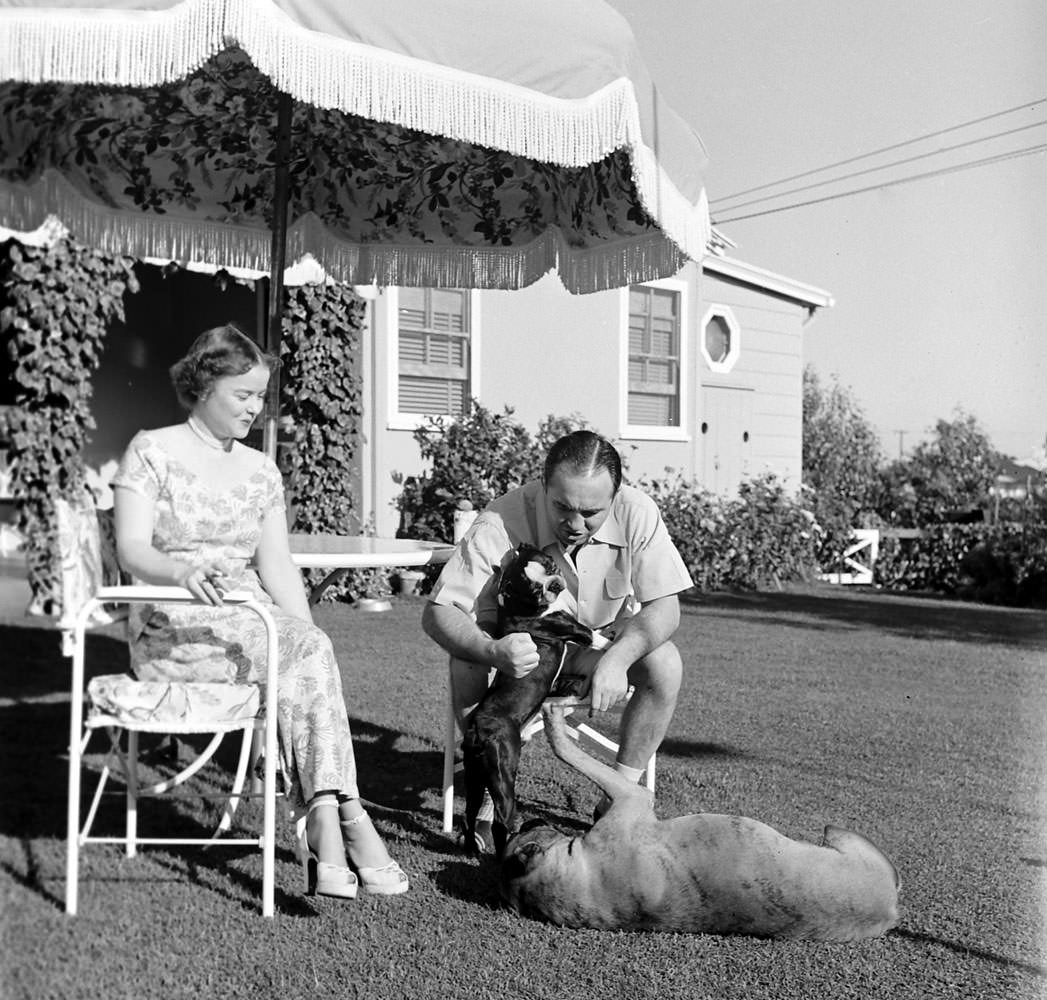 #7 Mickey Cohen with his wife, LaVonne, at home in Los Angeles, 1949.