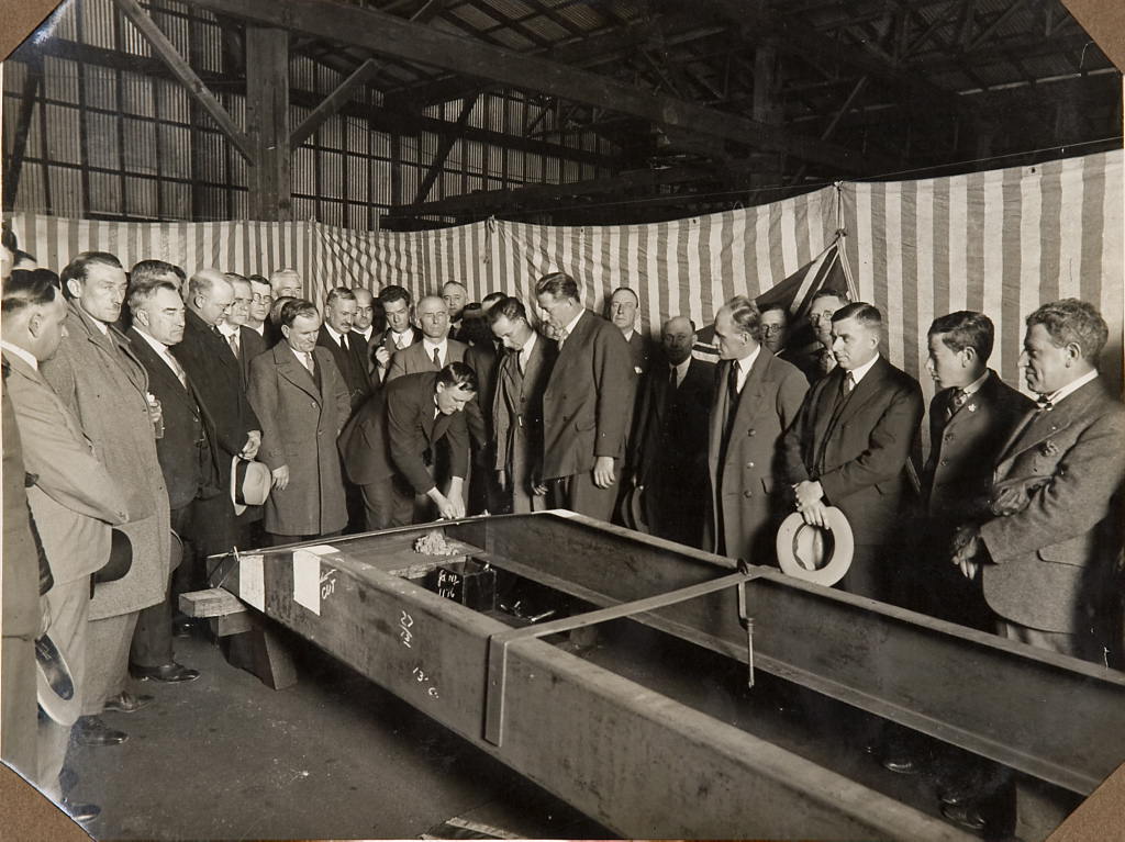 Men inspecting the frame of the car F.H. Stewart Enterprise, 1926 – 1936
