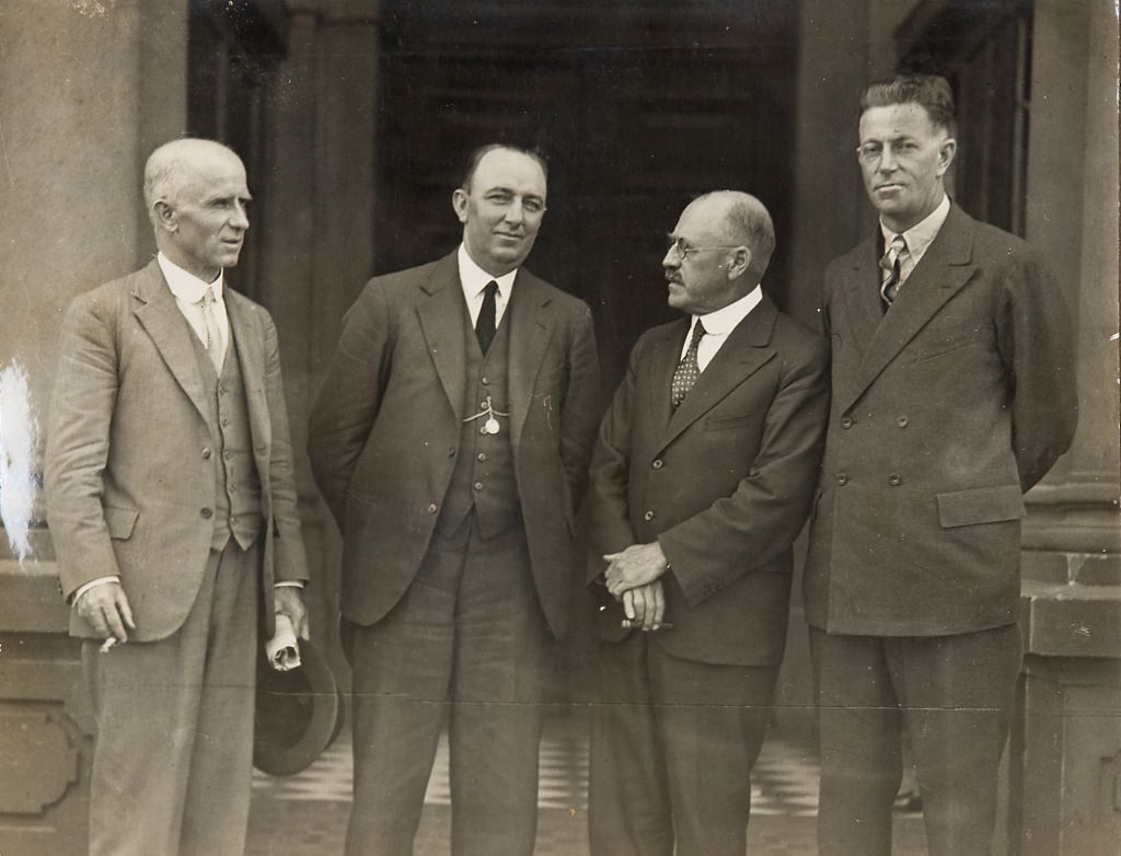 Norman Wizard Smith and Don Harkness and two other men (on steps of Sydney Town Hall], 1926 – 1936