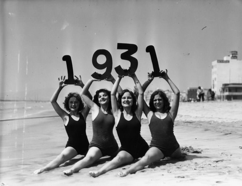 #1 Girls on the beach in Santa Monica, California in swim suits showing the new year 1931