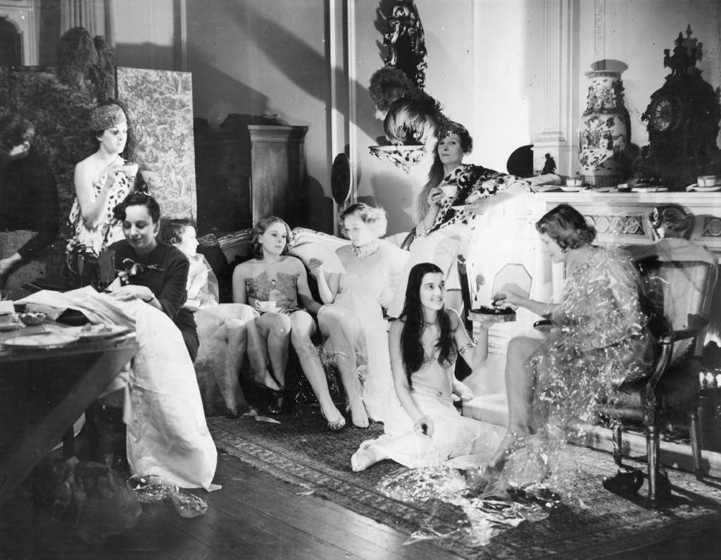 #42 Kensington Studios employees having a tea break, preparing for the Chelsea Arts Ball, 1935.