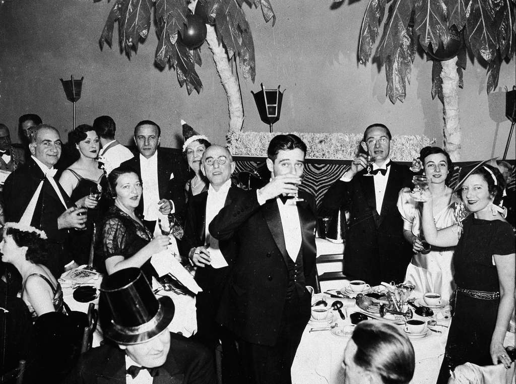 #43 People in formal attire celebrating New Year’s Eve at the El Morocco nightclub, New York City, 1935.