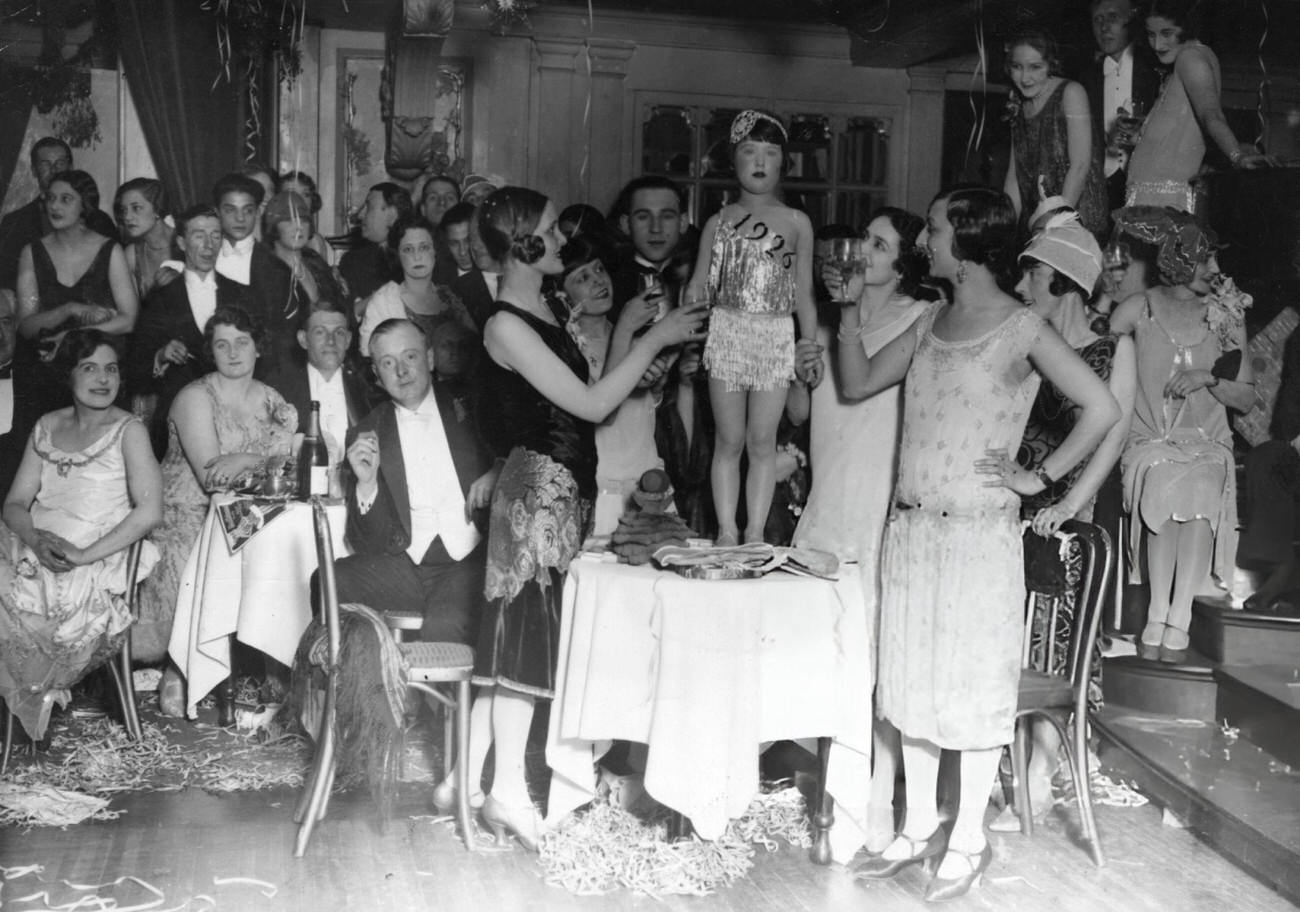 #13 A young girl named “Miss 1926” at a New Year’s party, 1926.