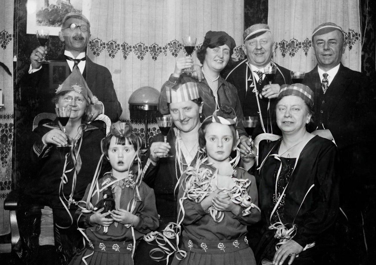 #23 Adults and children celebrating New Year’s Eve in Germany, 1927.