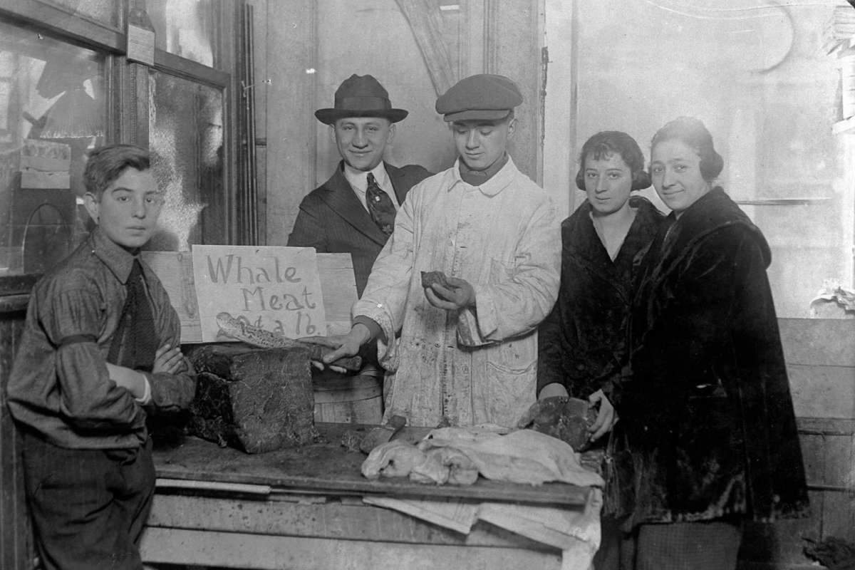 #50 A New York butcher selling whale meat, 1920s.