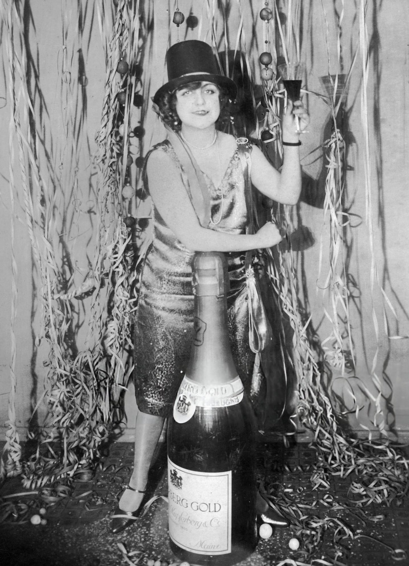 #9 A woman toasting at a New Year’s Eve party, 1920s.