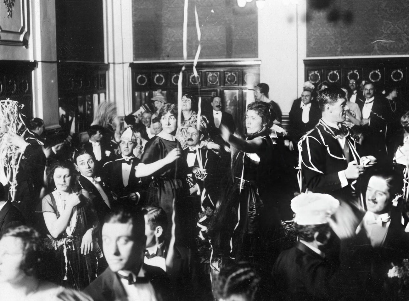 #1 New Year’s revelers celebrating at the Hotel Victoria in London, 1921.