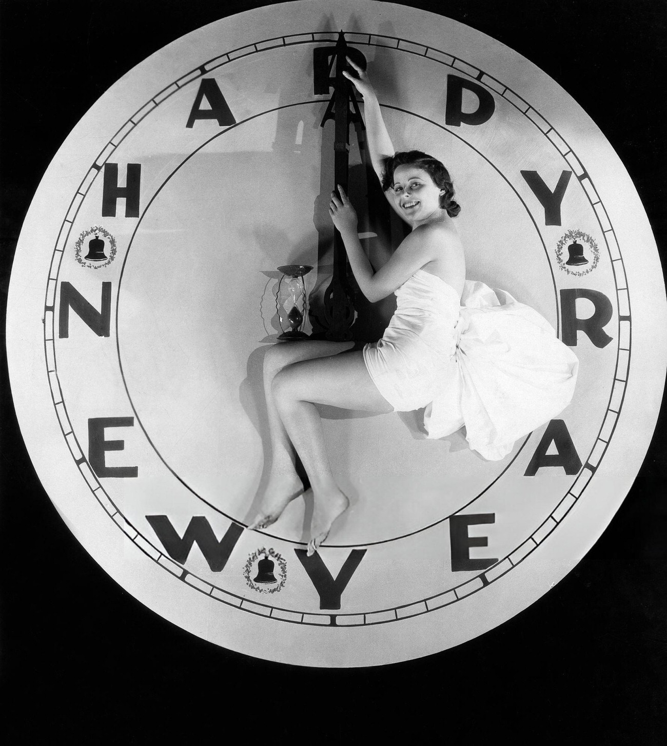 #29 A woman sitting on a watch at midnight on New Year’s Eve, 1928.