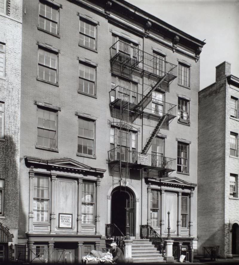 #11 Grove Street, No. 45, Manhattan. Man pushing cart past building with sign for Boykin School of Art.