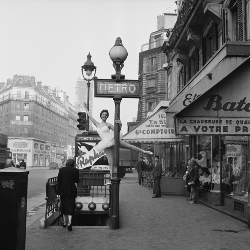 #13 A ballerina demonstrates the correct way to enter the Parisian métro, 1955.