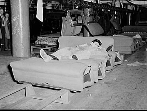 #14 Napping on an auto seat assembly line in Flint, Michigan, 1937.
