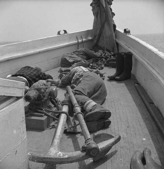 #19 Gloucester, Massachusetts fishermen napping on deck, 1943.