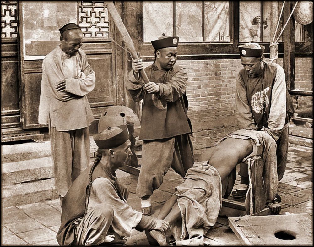 #67 Chinese punishment: whipping a lawbreaker, 1900.