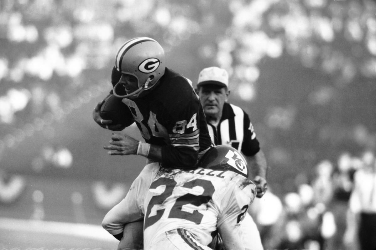 #15 Green Bay receiver Carroll Dale hit by the Chiefs’ Willie Mitchell, Super Bowl I, 1967