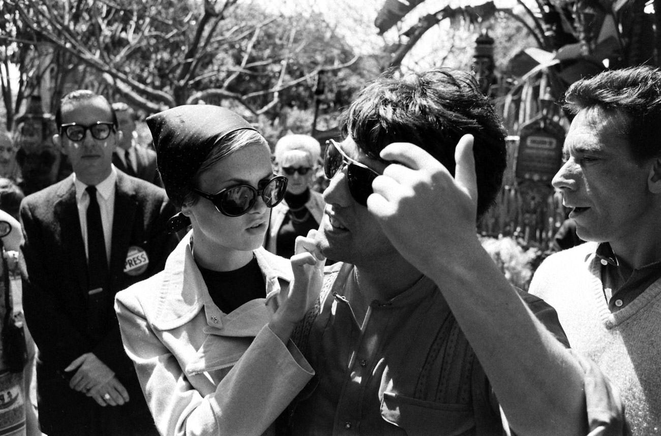 #13 Twiggy with boyfriend and manager Justin De Villeneuve at Disneyland during her first visit to the U.S., 1967.