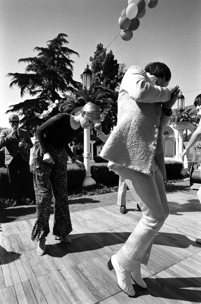#7 Twiggy (left) at a party thrown for her in Beverly Hills, 1967.