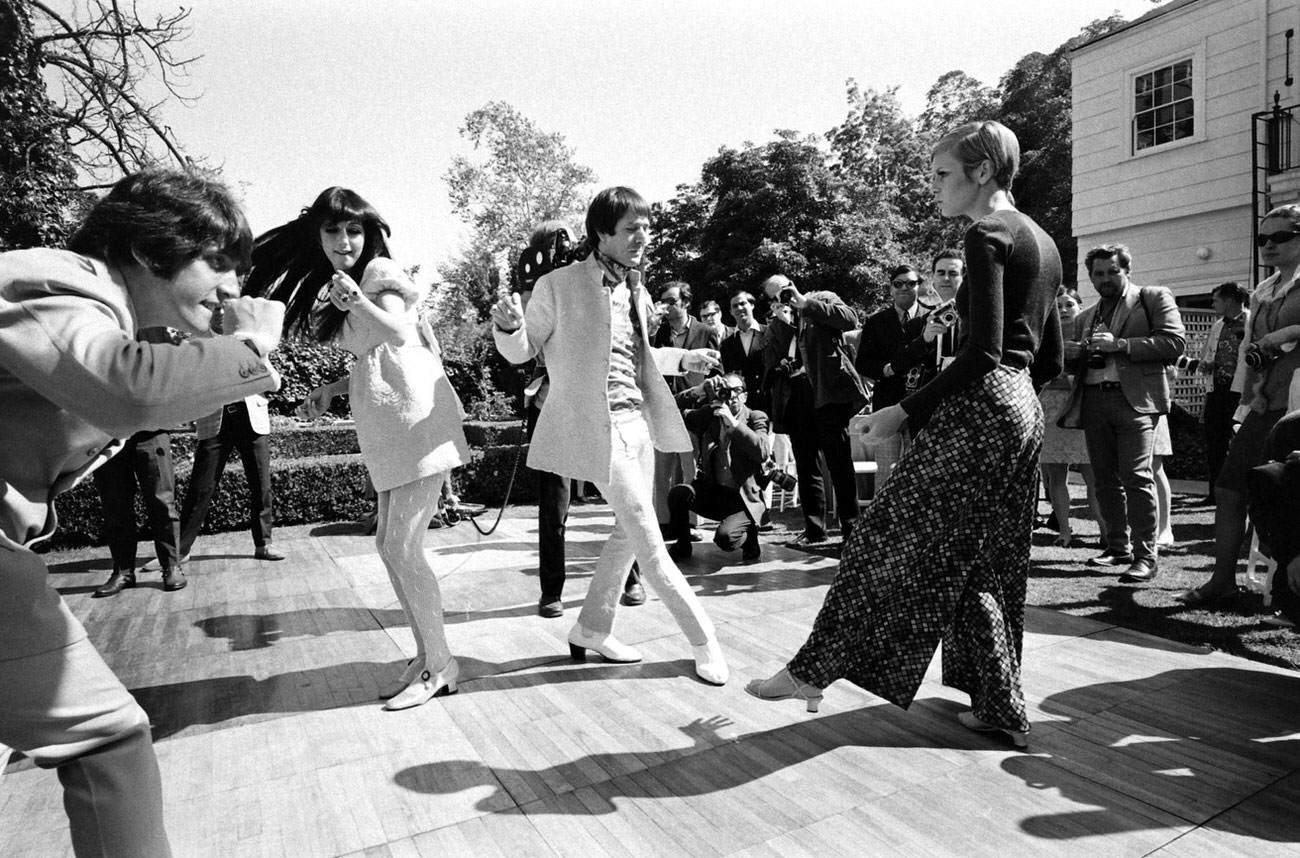 #8 Twiggy, Sonny and Cher and others dance at a party in Beverly Hills, 1967.