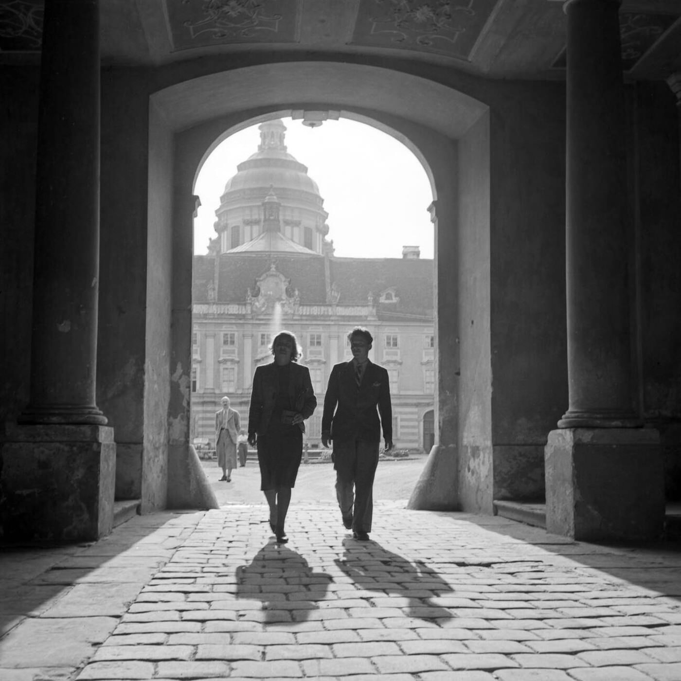 #5 A man and woman walking through Melk Abbey’s archway, Austria, 1930s.