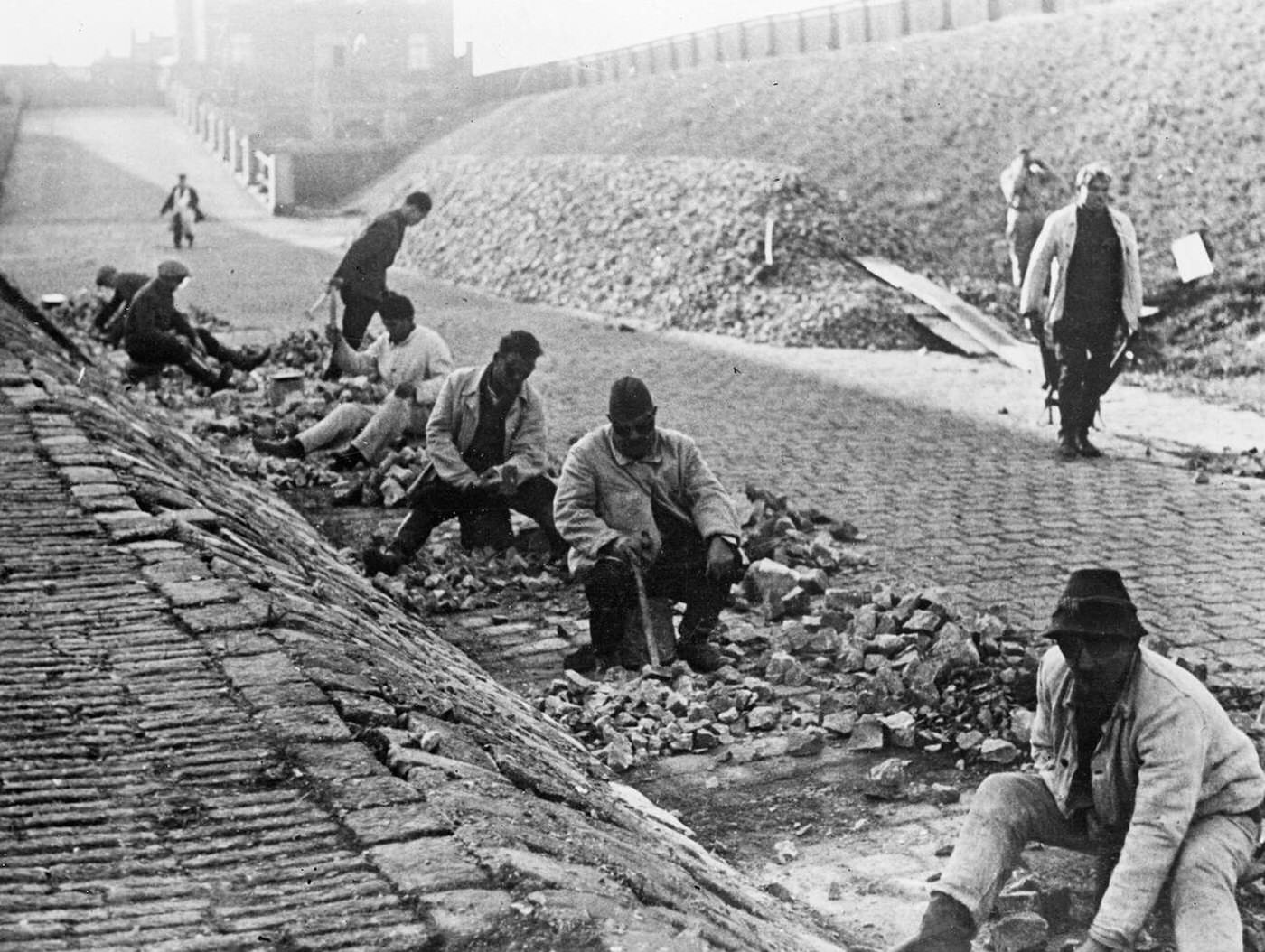#24 Beggars mending a road in Vienna, Austria, 1935.