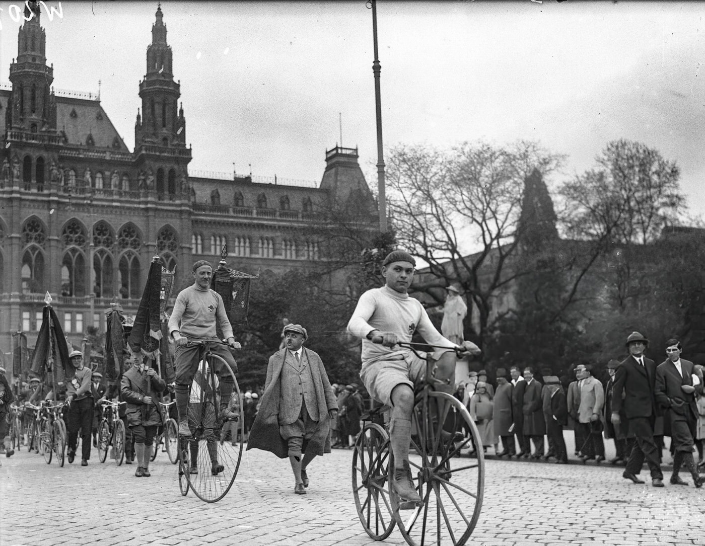 #55 Parade of cyclists at Vienna City Hall, 1930s.