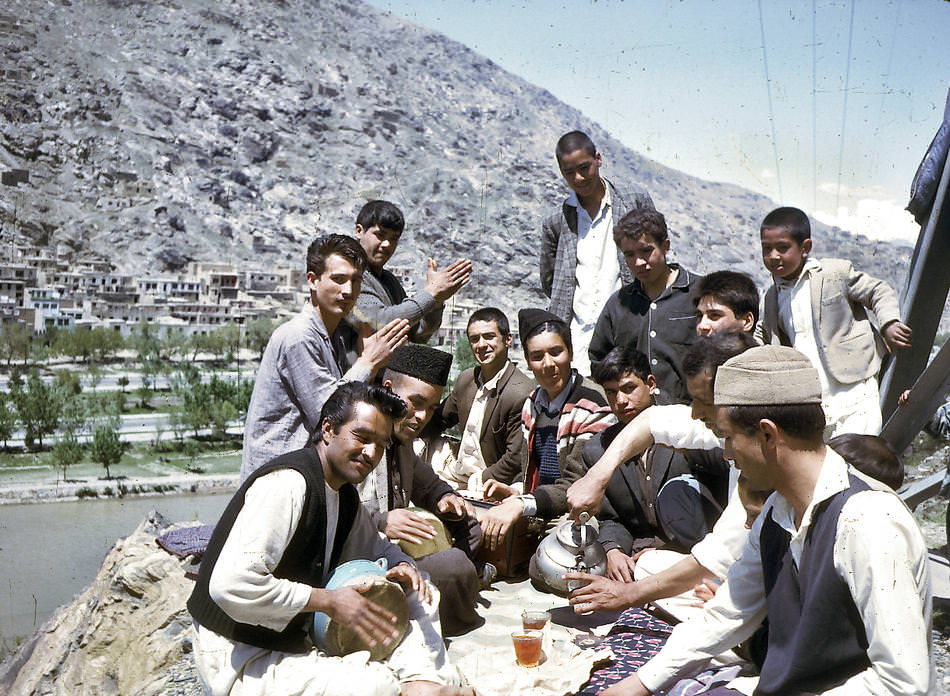 #32 A group of young Afghans share tea and music.