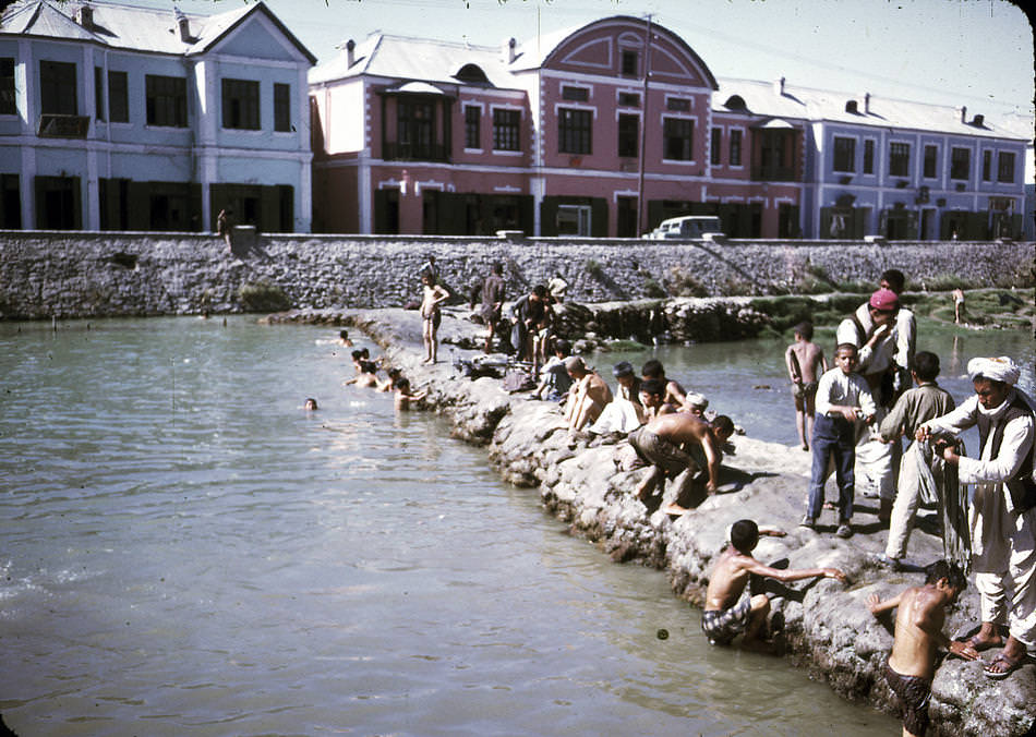 #8 Men and boys washing and swimming in the Kabul River.