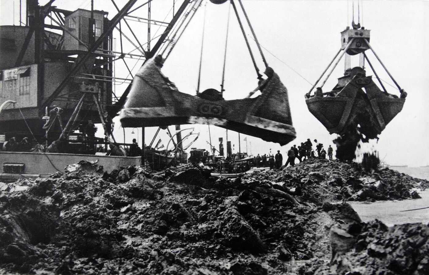 #48 Dredging silt to create a dam in Holland, 1932.