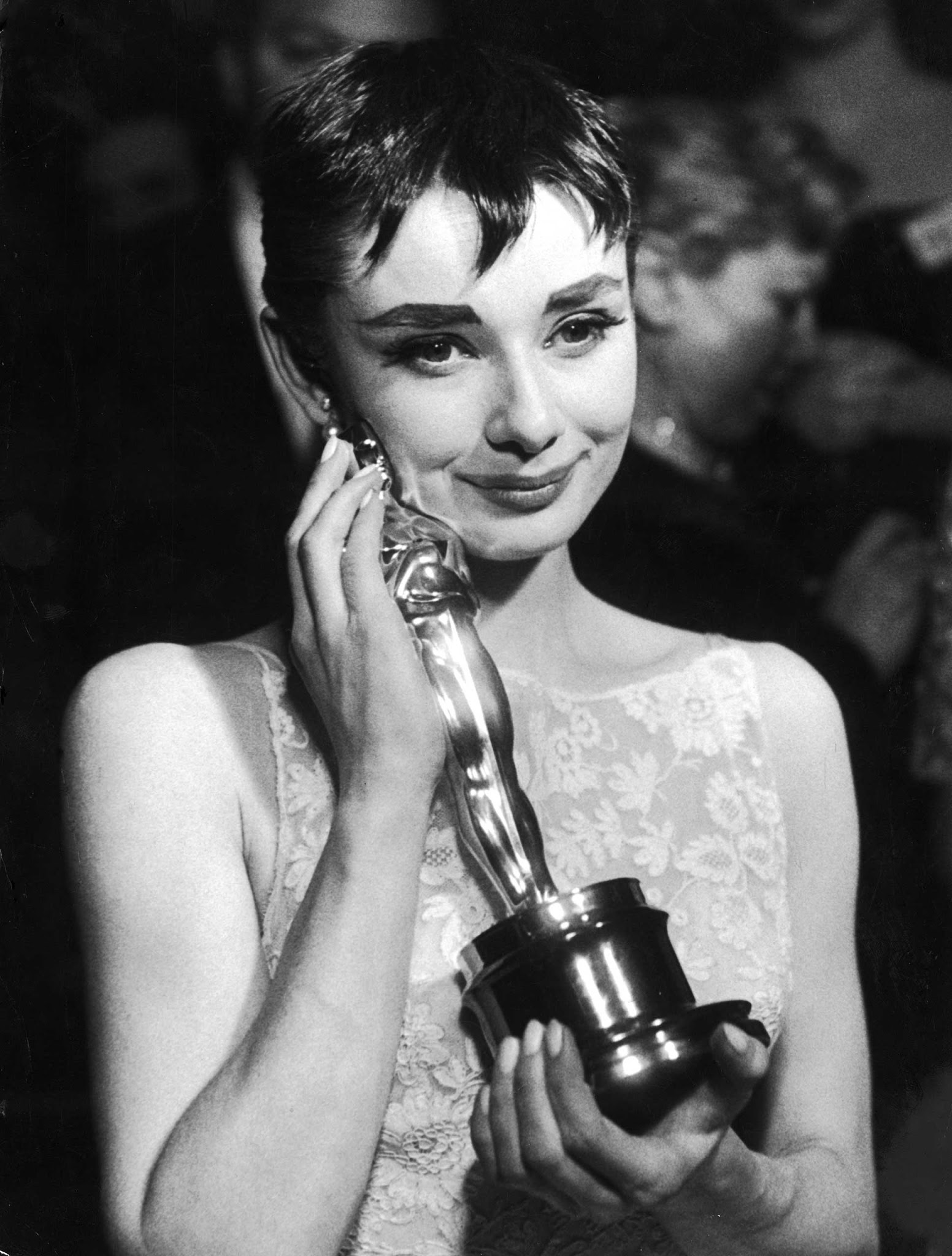 #6 Audrey Hepburn with the Oscar she won for Roman Holiday, 1954.