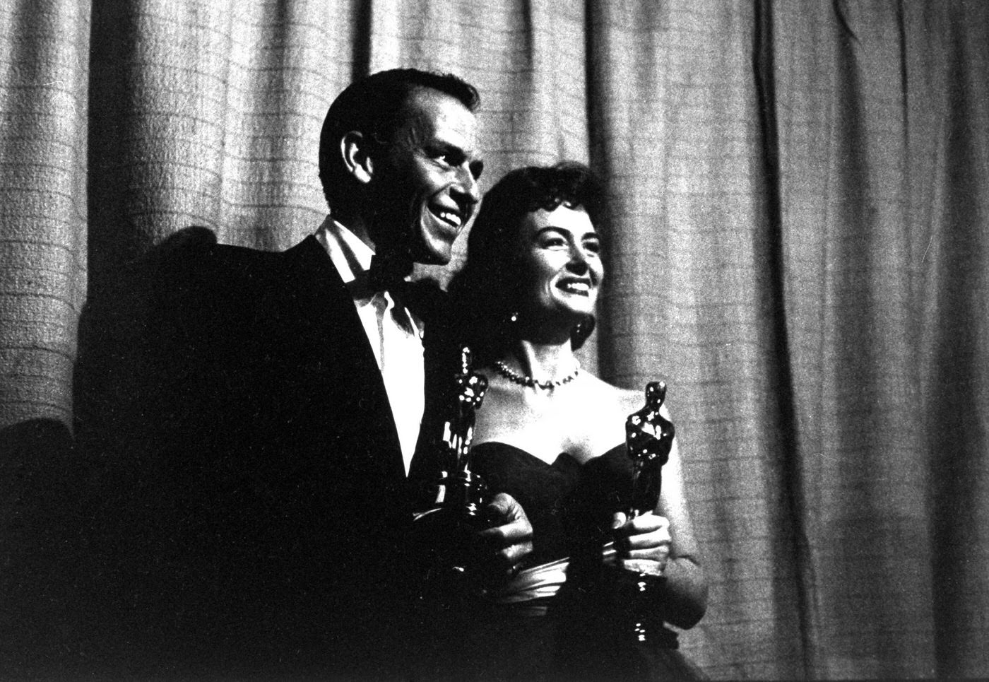 #8 Best Supporting Actor and Supporting Actress winners Frank Sinatra and Donna Reed (both for From Here to Eternity) and their Oscars, 1954.