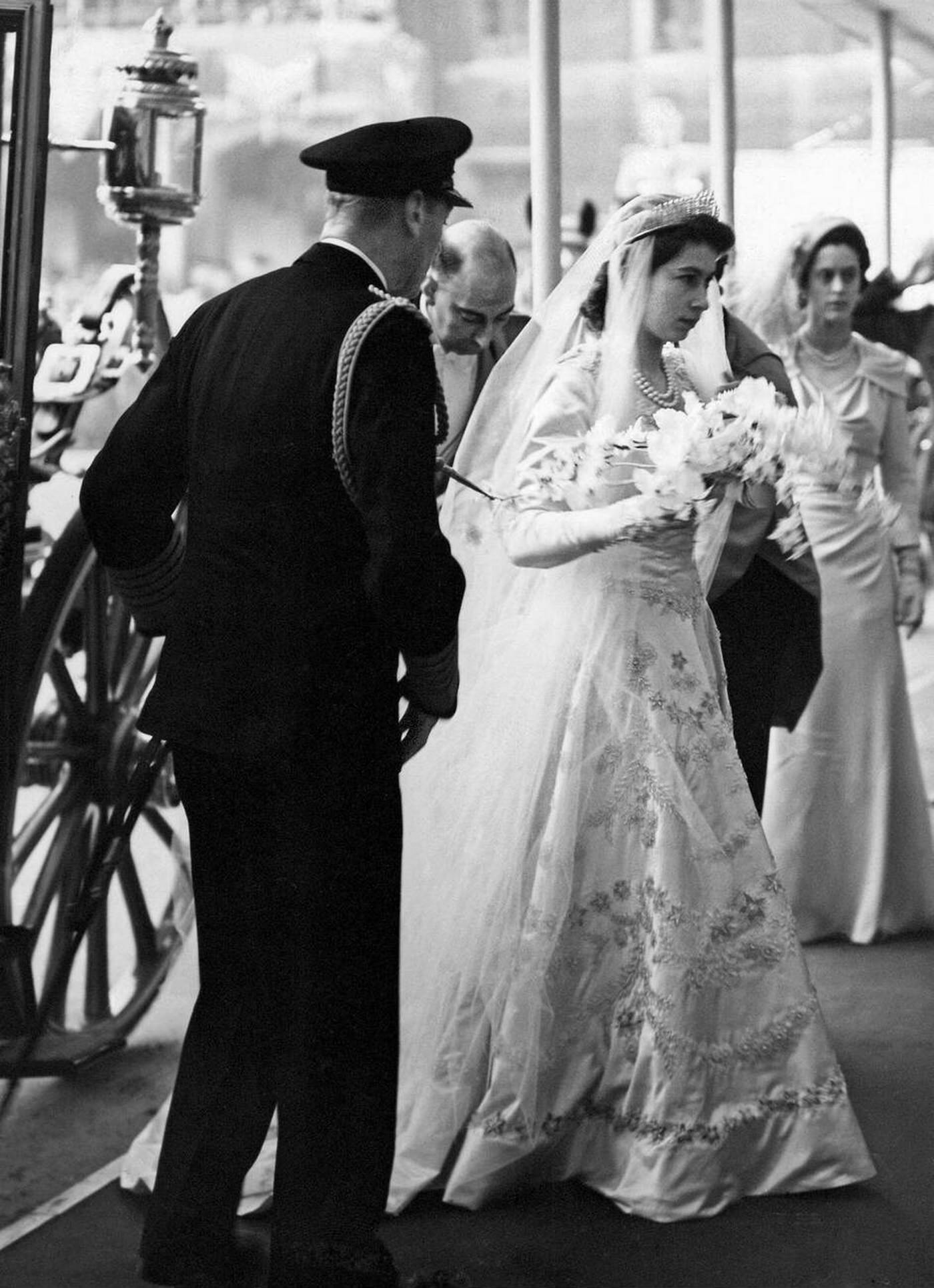 #30 Queen Elizabeth II arrives at Westminster Abbey with her father King George VI for her wedding to Prince Philip, 1947.
