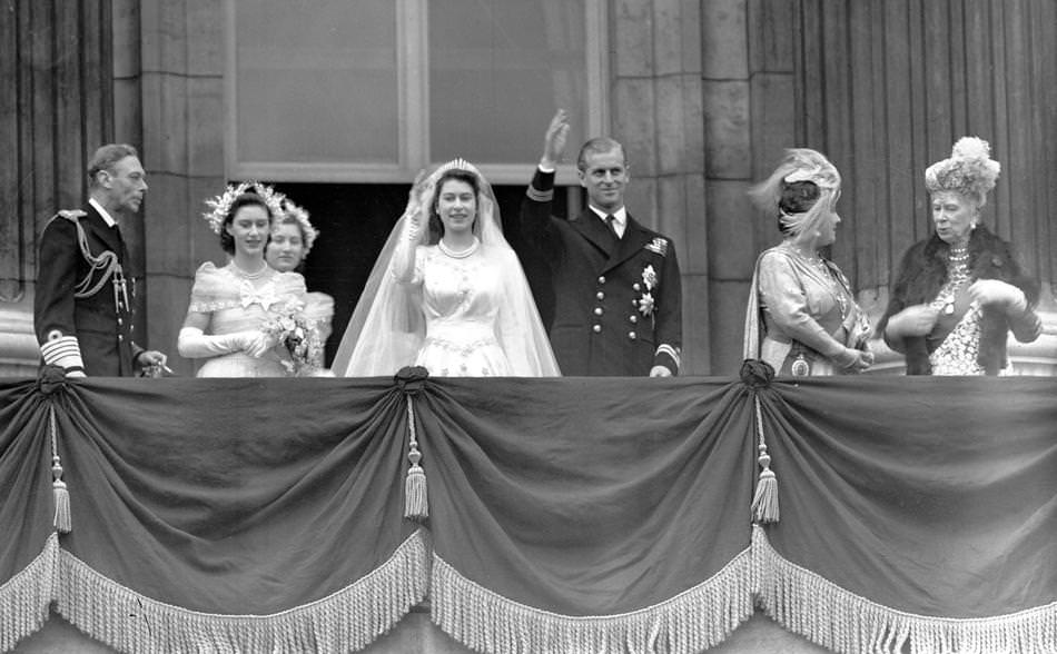 #7 Britain’s Queen Elizabeth II, then Princess Elizabeth, and her husband Prince Philip, the Duke of Edinburgh, wave to the crowd from the balcony of Buckingham Palace, London, in this Nov. 20, 1947 photo, after their wedding.