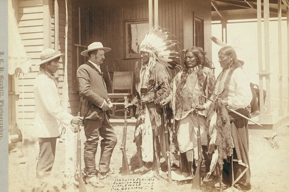 #1 Standing Elk, Running Hog, Little Wolf, Col. Oelrich, and Interpreter, 1890s.
