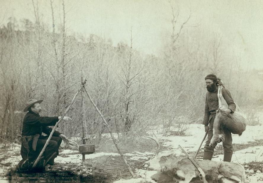 #33 “Hunting Deer”: Miners McMillan and Hubbard with their game near Deadwood in winter, 1888.
