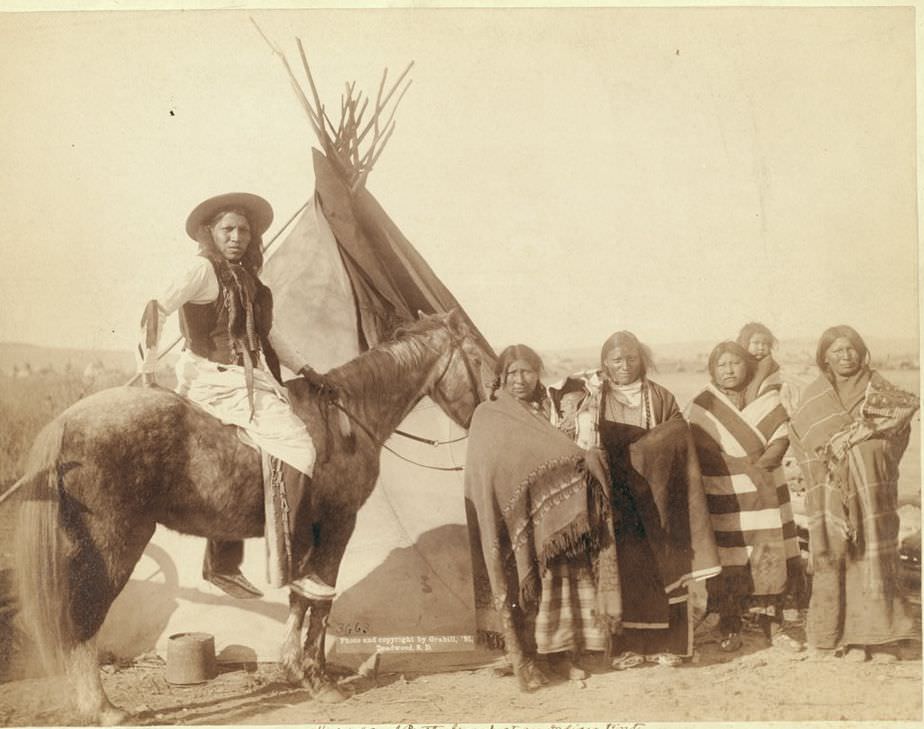 #69 A group at an Indian tent, 1891.