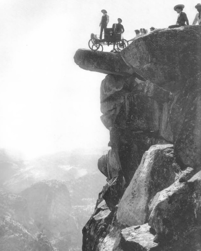 #1 Locomobile steam car on Overhanging Rock in 1900. This was the first automobile to enter Yosemite Valley. Oliver Lippincott drove up the steep, winding road to Glacier Point. The next morning it was hauled onto Overhanging Rock by ropes for this famous photograph.