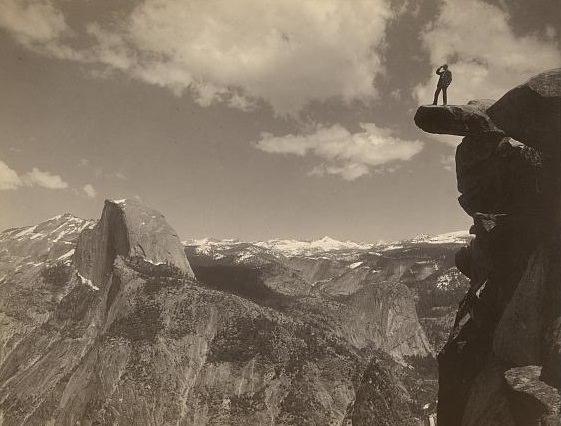 #8 Man standing on Glacier Point, facing Half Dome in Yosemite National Park, California, ca. 1901.