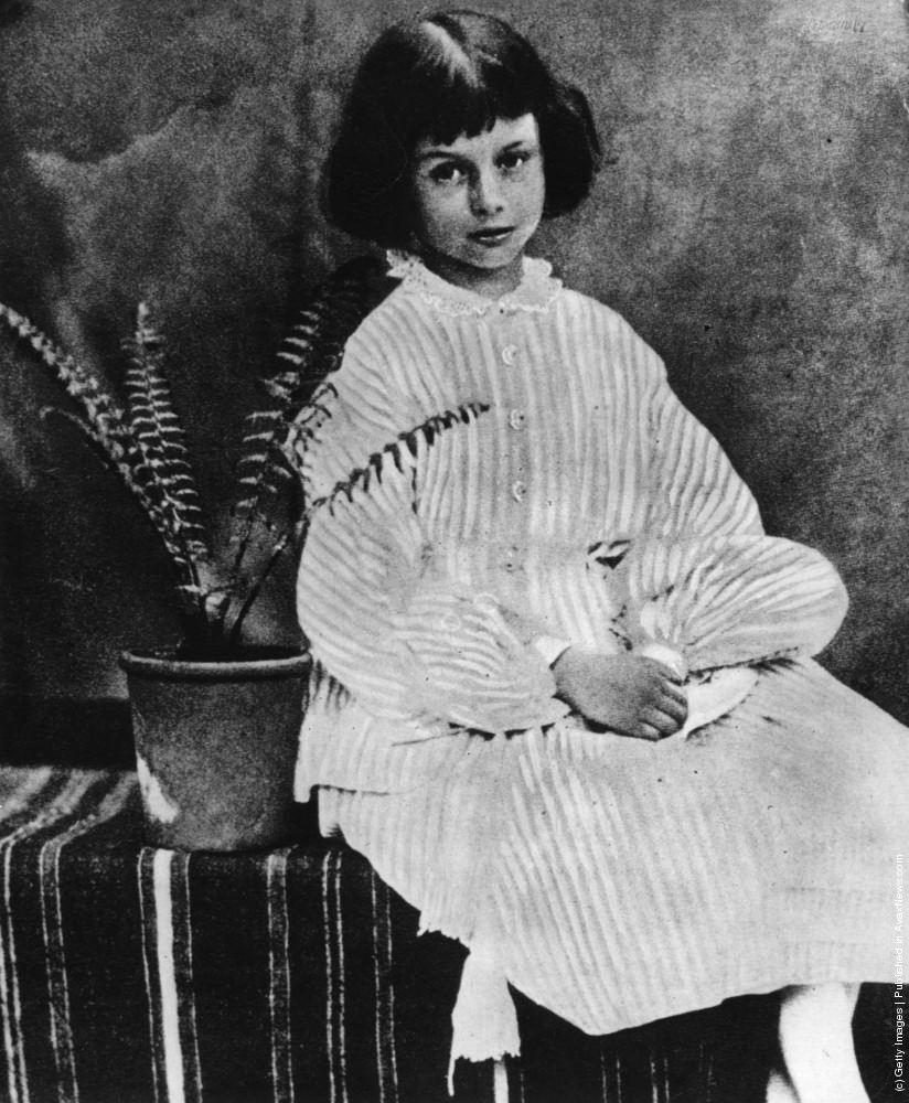 Alice Liddell sitting by a potted fern, 1860