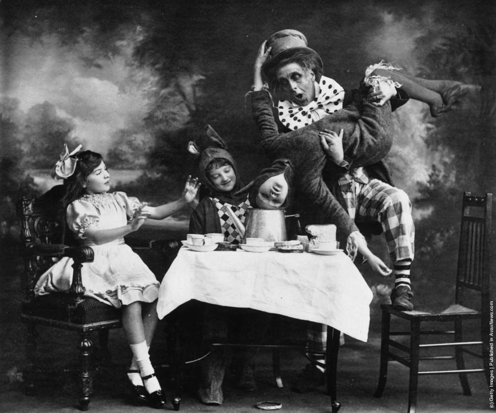 The Mad Hatter’s tea party from a theatre production of “Alice in Wonderland,” 1910